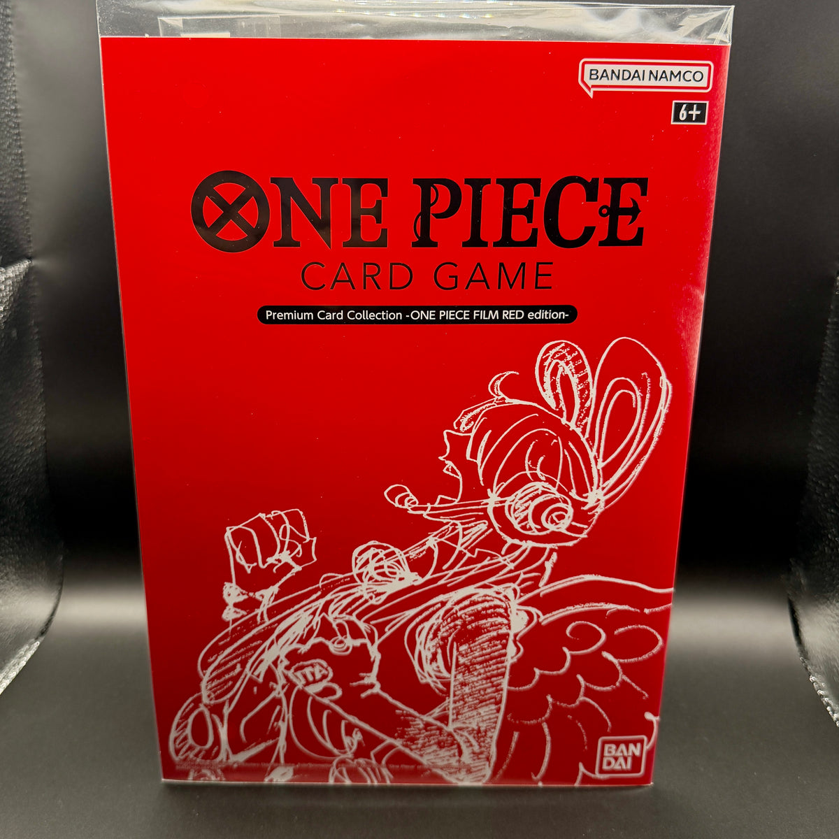 Front of the sealed 2023 One Piece Card Game FILM RED Premium Card Collection in English