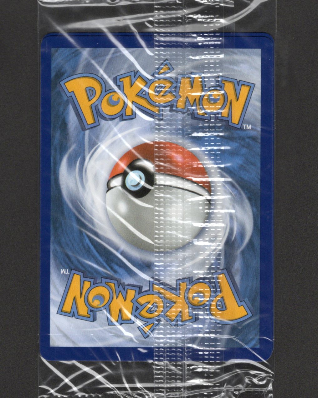 Back of the factory-sealed Mega Charizard X ex and Oricorio ex UPC promo pack showing a Pokémon card back through the wrapper.